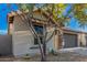 Single-story home with stone accents and a two-car garage at 28965 N 120Th Dr, Peoria, AZ 85383