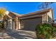 Single-story home with stone accents and a two-car garage at 28965 N 120Th Dr, Peoria, AZ 85383