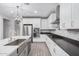 Modern kitchen with stainless steel appliances and a large island at 28965 N 120Th Dr, Peoria, AZ 85383