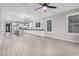 Modern kitchen with white cabinets, large island, and stainless steel appliances at 28965 N 120Th Dr, Peoria, AZ 85383