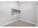 Laundry room with tile floors and shelving at 28965 N 120Th Dr, Peoria, AZ 85383