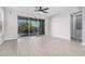 Bright living room with tile floors and sliding glass doors at 28965 N 120Th Dr, Peoria, AZ 85383