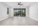 Bright living room with tile floors and sliding glass doors at 28965 N 120Th Dr, Peoria, AZ 85383