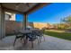 Patio with seating area and artificial turf at 28965 N 120Th Dr, Peoria, AZ 85383