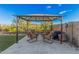 Relaxing backyard patio with covered seating area and artificial turf at 28965 N 120Th Dr, Peoria, AZ 85383