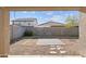 Backyard with gravel, patio, and block wall at 40925 W Patricia Ln, Maricopa, AZ 85138