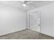 Bright bedroom with ceiling fan and carpet at 40925 W Patricia Ln, Maricopa, AZ 85138