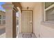 Front entry with arched entryway and security door at 40925 W Patricia Ln, Maricopa, AZ 85138