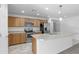 Bright kitchen with stainless steel appliances and an island at 40925 W Patricia Ln, Maricopa, AZ 85138
