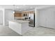 Modern kitchen featuring stainless steel appliances and an island at 40925 W Patricia Ln, Maricopa, AZ 85138