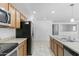 Modern kitchen with stainless steel appliances and an island at 40925 W Patricia Ln, Maricopa, AZ 85138