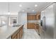 Modern kitchen with stainless steel appliances and an island at 40925 W Patricia Ln, Maricopa, AZ 85138
