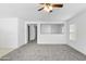 Living room view with hallway and interior doors at 40925 W Patricia Ln, Maricopa, AZ 85138