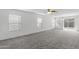 Spacious living room with sliding glass doors to patio at 40925 W Patricia Ln, Maricopa, AZ 85138