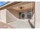Covered patio with ceiling fan and sliding glass door at 40925 W Patricia Ln, Maricopa, AZ 85138