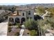 Two-story home with tile roof, landscaped yard, and mountain backdrop at 4510 N Pierce Ct, Buckeye, AZ 85396