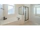 Relaxing bathroom with soaking tub and glass shower at 4510 N Pierce Ct, Buckeye, AZ 85396