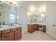 Double vanity bathroom with a large mirror and tile floor at 4510 N Pierce Ct, Buckeye, AZ 85396