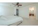 Main bedroom with ensuite bathroom and access to a hallway at 4510 N Pierce Ct, Buckeye, AZ 85396