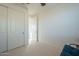 Bright bedroom with double doors and closet at 4510 N Pierce Ct, Buckeye, AZ 85396