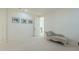 Secondary bedroom with chaise lounge and access to upper floor at 4510 N Pierce Ct, Buckeye, AZ 85396