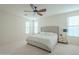Spacious bedroom with large windows and ceiling fan at 4510 N Pierce Ct, Buckeye, AZ 85396
