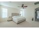 Bright bedroom featuring a king-size bed and ensuite access at 4510 N Pierce Ct, Buckeye, AZ 85396