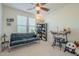 Bedroom with a sofa, desk, and bookcase at 4510 N Pierce Ct, Buckeye, AZ 85396