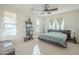 Bedroom with king bed and built-in shelving unit at 4510 N Pierce Ct, Buckeye, AZ 85396