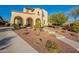 Two-story home with arched entryway and desert landscaping at 4510 N Pierce Ct, Buckeye, AZ 85396