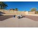 Landscaped backyard with a firepit and seating area at 4510 N Pierce Ct, Buckeye, AZ 85396