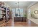 Home office with built-in bookcase and large desk at 4510 N Pierce Ct, Buckeye, AZ 85396