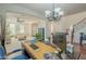 Home office with a large desk, hardwood floors, and view of the stairs at 4510 N Pierce Ct, Buckeye, AZ 85396