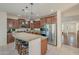Eat-in kitchen with large island, stainless steel appliances, and hardwood floors at 4510 N Pierce Ct, Buckeye, AZ 85396