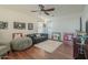 Living room with sofa, beanbag chair, and wood floors at 4510 N Pierce Ct, Buckeye, AZ 85396