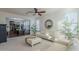 Living room features white couches, a ceiling fan, and hardwood floors at 4510 N Pierce Ct, Buckeye, AZ 85396