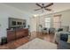 Living area with two armchairs and a large TV at 4510 N Pierce Ct, Buckeye, AZ 85396