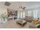 Comfortable living room with recessed lighting, large windows and French doors at 4510 N Pierce Ct, Buckeye, AZ 85396
