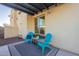Cozy patio with two chairs and a side table under a pergola at 4510 N Pierce Ct, Buckeye, AZ 85396