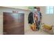 Large walk-in closet with shelving and hanging rods at 4510 N Pierce Ct, Buckeye, AZ 85396