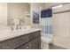 Clean bathroom with tub, shower, and gray vanity at 5273 N 207Th Dr, Buckeye, AZ 85396
