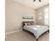 Bright bedroom with a queen-size bed and large windows at 5273 N 207Th Dr, Buckeye, AZ 85396