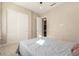 Bright bedroom with double door closet and neutral decor at 5273 N 207Th Dr, Buckeye, AZ 85396