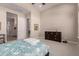 Bedroom with carpet, dresser, and ensuite bathroom access at 5273 N 207Th Dr, Buckeye, AZ 85396