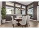 Spacious dining area with large windows and modern lighting at 5273 N 207Th Dr, Buckeye, AZ 85396