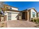 Modern home with attractive curb appeal and landscaped front yard at 5273 N 207Th Dr, Buckeye, AZ 85396