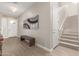 Spacious foyer with bench, art, and staircase at 5273 N 207Th Dr, Buckeye, AZ 85396