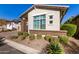 Landscaped front yard with drought-tolerant plants at 5273 N 207Th Dr, Buckeye, AZ 85396