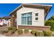 Landscaped front yard with drought-tolerant plants at 5273 N 207Th Dr, Buckeye, AZ 85396