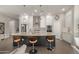 Modern kitchen with large island,granite countertops, and stainless steel appliances at 5273 N 207Th Dr, Buckeye, AZ 85396